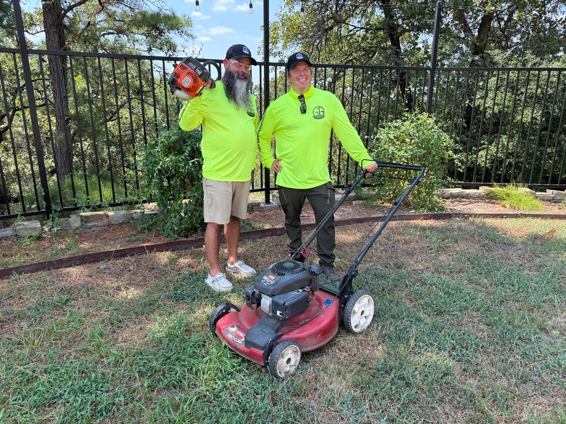 Two Good Ground crew members with a mower and trimmer at a job site.